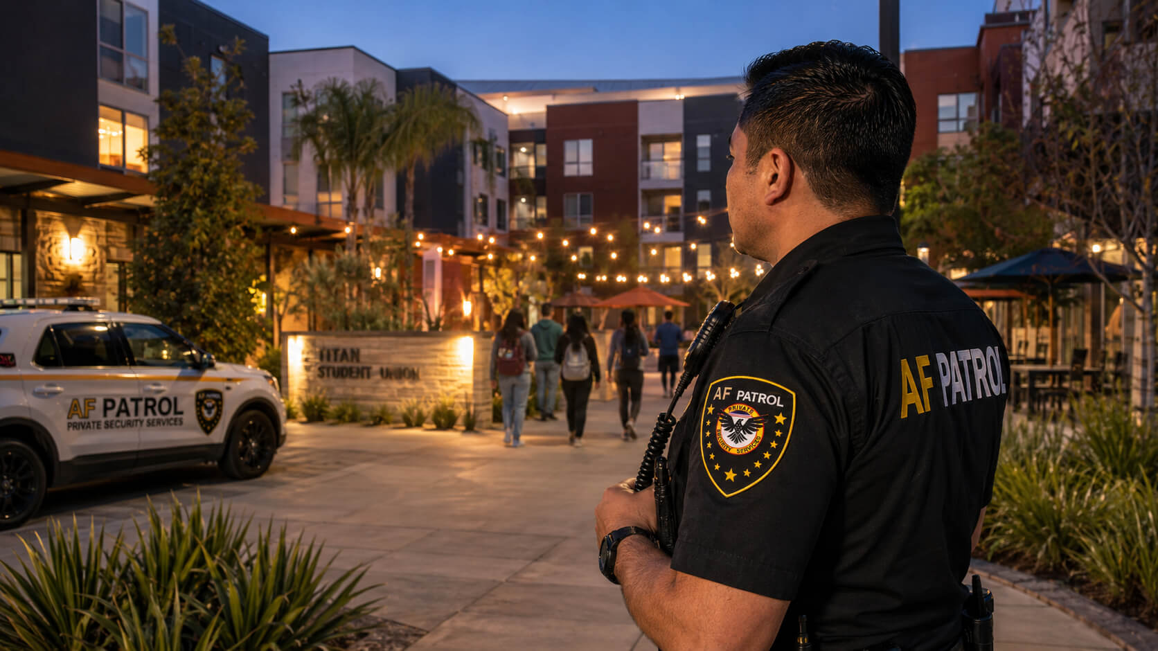 AF Patrol security guard interacting with a hotel guest at a valet entrance in Orange County during evening, guiding the guest while maintaining a professional security presence.